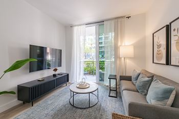 Modern living room space at one plantation apartments in plantation, fl 33324
